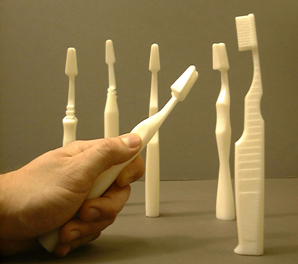 Prototype toothbrush grips are shown.