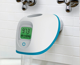 The digital bath spout cover is shown over a bathtub faucet and shows that the water temperature is at a safe temperature, which is indicated by the reading (97.3 degrees) and the color green.