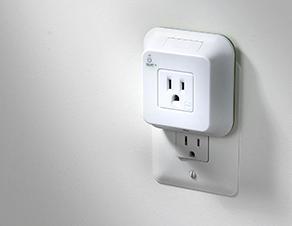 The Wi-Fi controlled power outlet manager in shown plugged into an outlet.