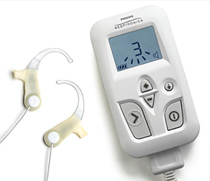 The non-invasive sleep aid is shown with the device itself, which resembles a PDA and the earpieces.