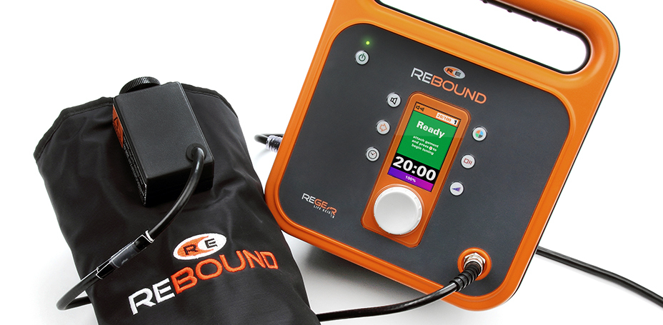 The Rebound System is depicted. A black sleeve is intended to be worn on an extremity and it is connected to an orange and black controller.